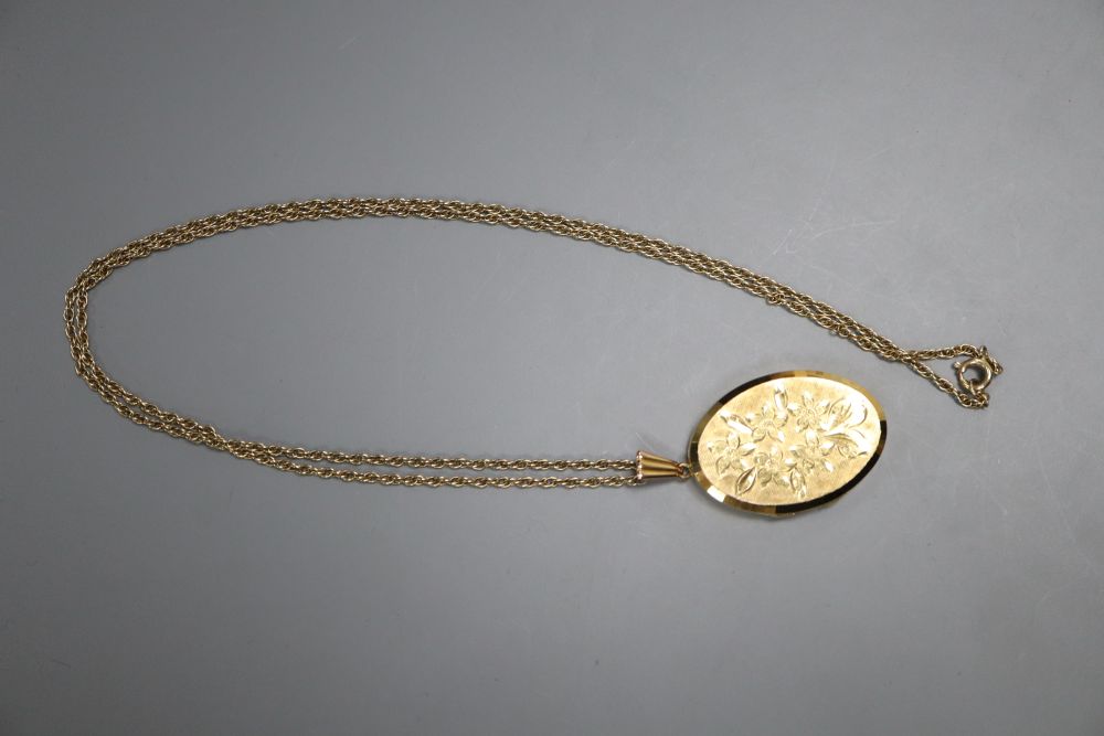 A modern 9ct gold oval locket, on a 9ct chain, locket 32mm, gross 11.4 grams.